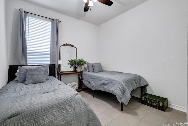 5219 Wolf Bane, San Antonio, TX 78261 - bedroom featuring light tile patterned floors, a ceiling fan, and baseboards