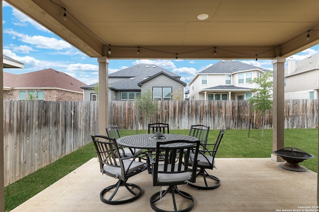 5219 Wolf Bane, San Antonio, TX 78261 - view of patio featuring outdoor dining space and a residential view