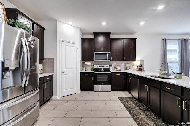 5219 Wolf Bane, San Antonio, TX 78261 - kitchen with stainless steel appliances, a sink, backsplash, light countertops, and recessed lighting