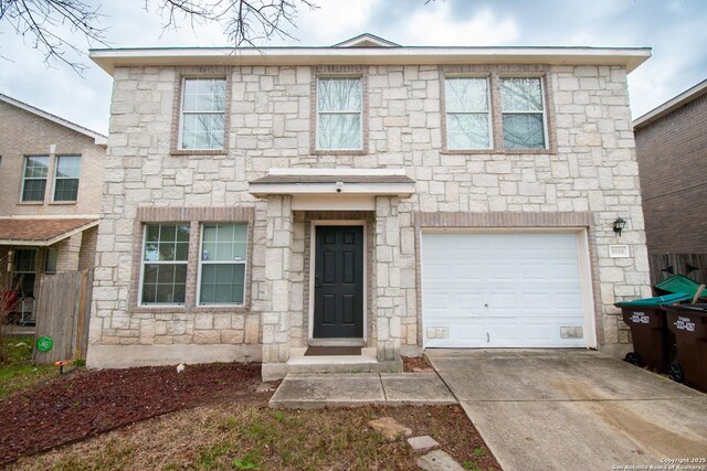 9668 Shorebird, San Antonio, TX 78245 - view of front of house featuring an attached garage, stone siding, and concrete driveway