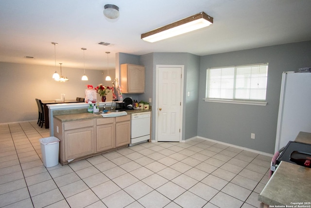 9668 Shorebird, San Antonio, TX 78245 - kitchen featuring white appliances, pendant lighting, a chandelier, a peninsula, and baseboards