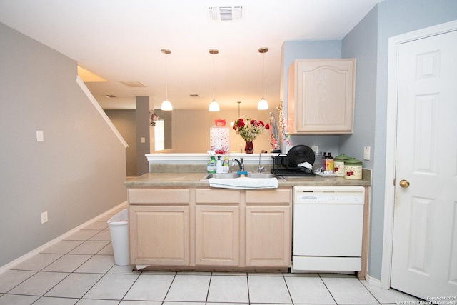 9668 Shorebird, San Antonio, TX 78245 - kitchen featuring dishwasher, a peninsula, a sink, light tile patterned floors, and light brown cabinetry