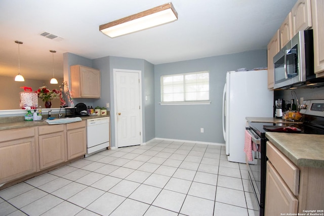 9668 Shorebird, San Antonio, TX 78245 - kitchen featuring stainless steel appliances, a sink, light brown cabinetry, hanging light fixtures, and baseboards
