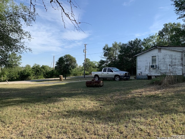 251 Karrass Rd, Kingsbury, TX 78638 - view of green lawn with cooling unit
