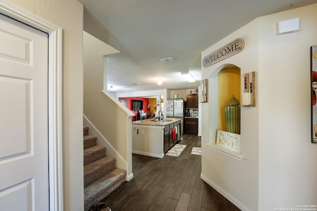 4310 Gambels Quail, Converse, TX 78109 - hall with a sink, dark wood-style flooring, stairway, and baseboards