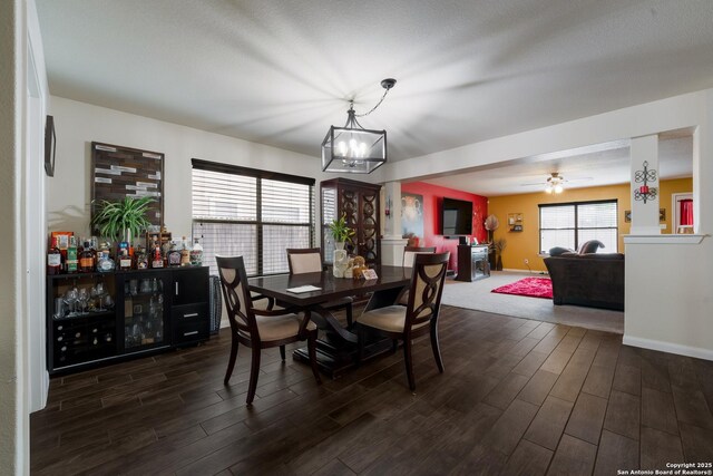 4310 Gambels Quail, Converse, TX 78109 - dining space with dark wood-style flooring, a chandelier, baseboards, and a ceiling fan