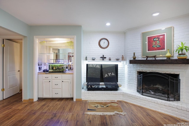 11700 Mission Trce, San Antonio, TX 78230 - living room with a fireplace, wood finished floors, and brick wall