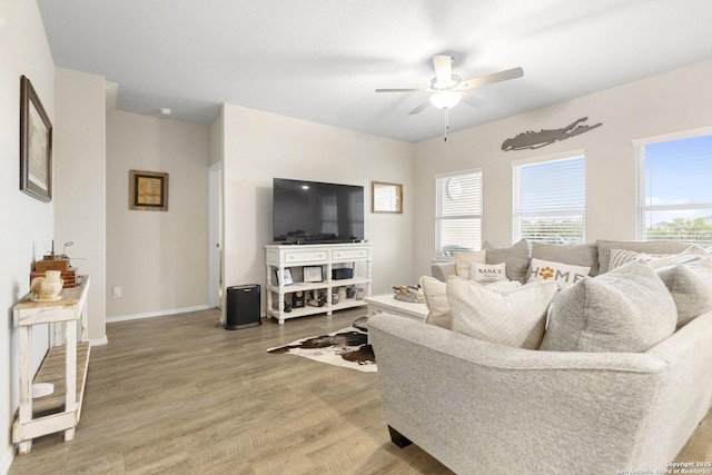 700 Ridge Vw, Seguin, TX 78155 - living room with a ceiling fan, wood finished floors, and baseboards