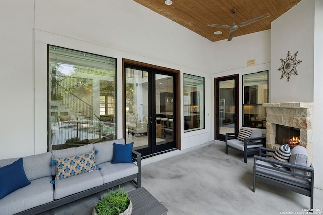 17706 Wild Basin, San Antonio, TX 78258 - view of patio / terrace with an outdoor living space with a fireplace, ceiling fan, french doors, and stairs