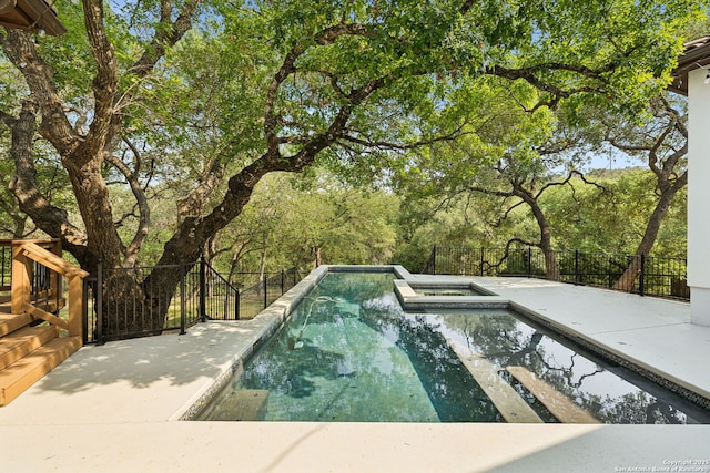 17706 Wild Basin, San Antonio, TX 78258 - view of pool featuring a pool with connected hot tub and a patio