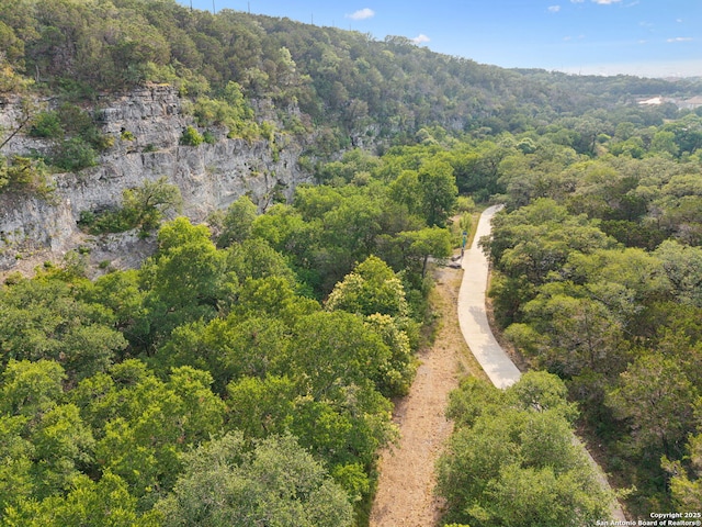 17706 Wild Basin, San Antonio, TX 78258 - aerial overview of property's location featuring a heavily wooded area