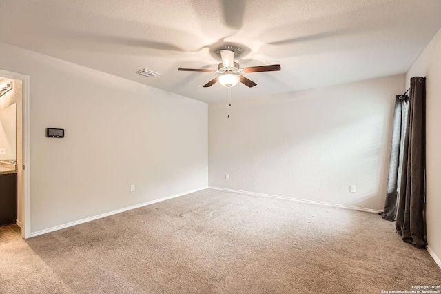 10110 Raspberry Oak, San Antonio, TX 78223 - spare room with a ceiling fan, light carpet, baseboards, and a textured ceiling