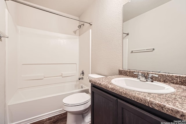 10110 Raspberry Oak, San Antonio, TX 78223 - bathroom with toilet, vanity, shower / bath combination, wood finished floors, and a textured wall
