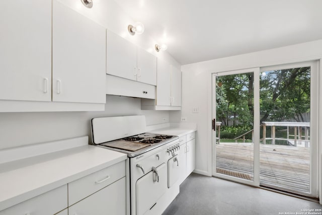 113 E Sunset, San Antonio, TX 78209 - kitchen featuring under cabinet range hood, light countertops, white cabinetry, and baseboards