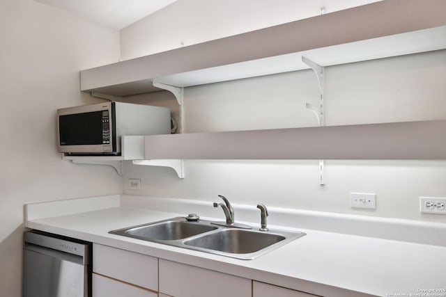 113 E Sunset, San Antonio, TX 78209 - kitchen with appliances with stainless steel finishes, a sink, light countertops, and open shelves