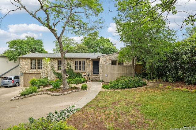 113 E Sunset, San Antonio, TX 78209 - mid-century inspired home featuring stone siding and concrete driveway