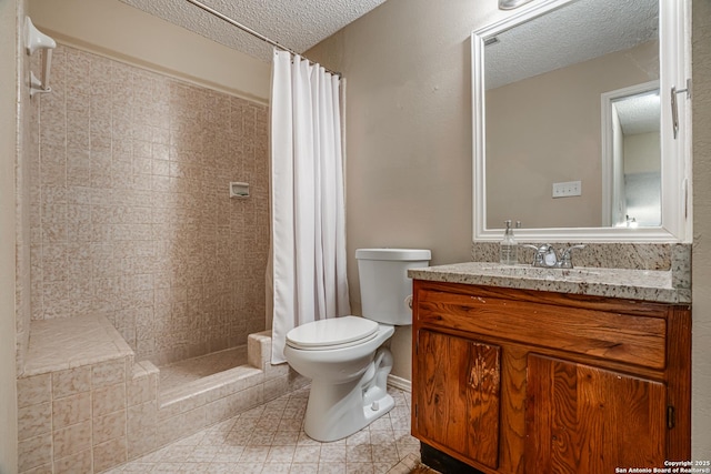 13426 Marceline, San Antonio, TX 78232 - bathroom with a textured ceiling, toilet, tiled shower, and vanity