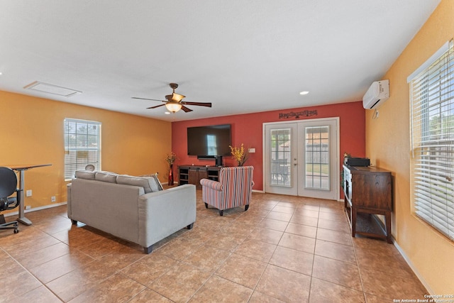 1703 Desert Willow, San Antonio, TX 78227 - living area with a wall unit AC, light tile patterned flooring, french doors, a ceiling fan, and baseboards