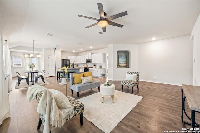 9702 Tupelo Holw, San Antonio, TX 78254 - living area featuring baseboards, recessed lighting, a ceiling fan, light wood finished floors, and a chandelier