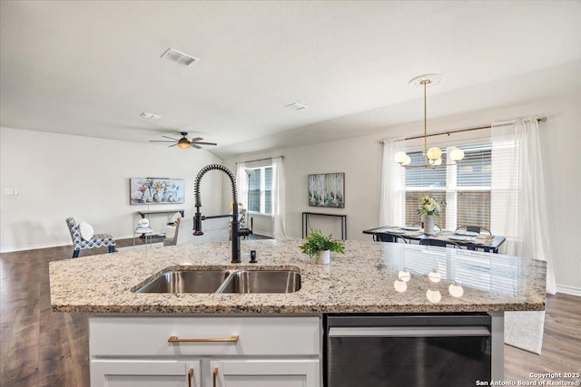 9702 Tupelo Holw, San Antonio, TX 78254 - kitchen with dishwasher, a sink, white cabinetry, ceiling fan, and a chandelier