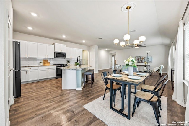 9702 Tupelo Holw, San Antonio, TX 78254 - dining space featuring a chandelier, dark wood-style floors, recessed lighting, and baseboards