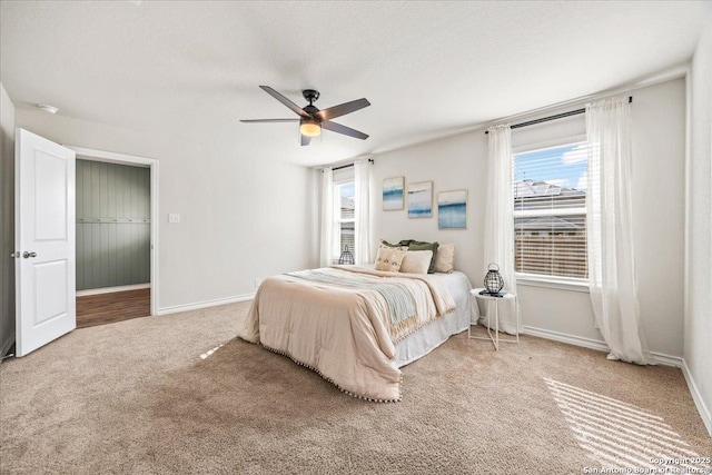 9702 Tupelo Holw, San Antonio, TX 78254 - bedroom featuring light colored carpet, baseboards, and ceiling fan