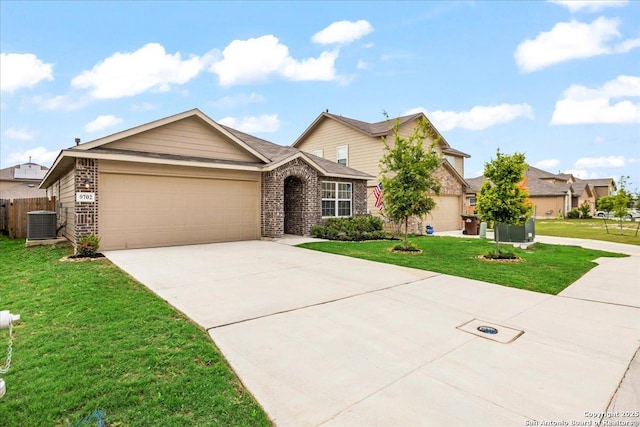 9702 Tupelo Holw, San Antonio, TX 78254 - view of front of property with an attached garage, concrete driveway, cooling unit, and brick siding