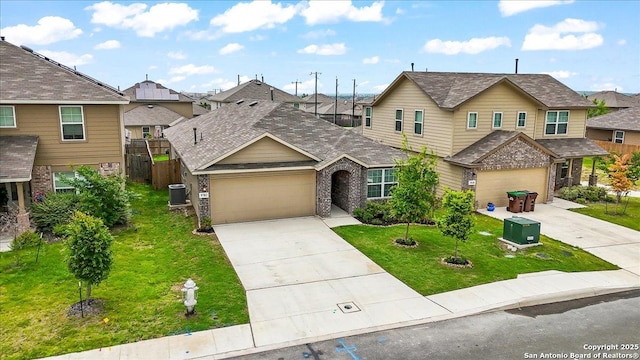 9702 Tupelo Holw, San Antonio, TX 78254 - view of front of house featuring driveway, central AC unit, a residential view, an attached garage, and brick siding