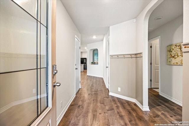 9702 Tupelo Holw, San Antonio, TX 78254 - hallway featuring arched walkways, dark wood-type flooring, baseboards, and recessed lighting