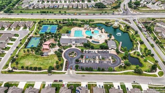 9702 Tupelo Holw, San Antonio, TX 78254 - aerial overview of property's location featuring a pool, a large body of water, and nearby suburban area