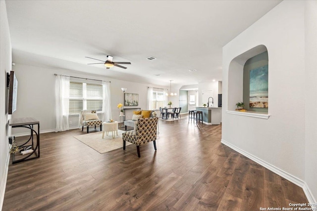 9702 Tupelo Holw, San Antonio, TX 78254 - living room with a ceiling fan, dark wood-style flooring, and baseboards