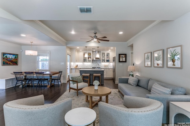 247 Brightwood Pl, San Antonio, TX 78209 - living area featuring dark wood-style floors, ornamental molding, ceiling fan, recessed lighting, and baseboards