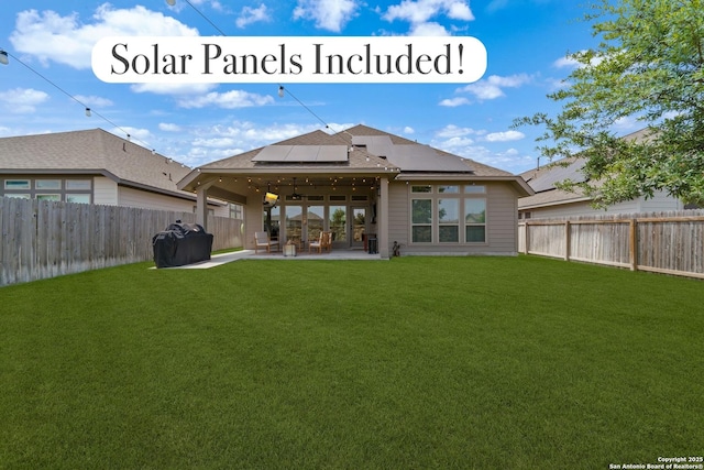 9102 War Wagon, San Antonio, TX 78254 - back of property featuring solar panels, ceiling fan, roof with shingles, and a patio