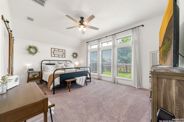 9102 War Wagon, San Antonio, TX 78254 - bedroom featuring carpet, a ceiling fan, and a barn door