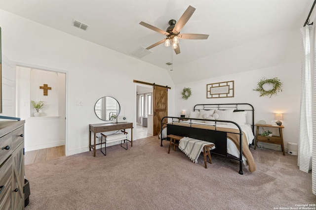 9102 War Wagon, San Antonio, TX 78254 - carpeted bedroom featuring a barn door, lofted ceiling, a ceiling fan, and baseboards