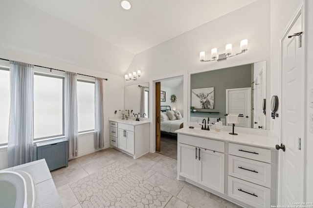 9102 War Wagon, San Antonio, TX 78254 - ensuite bathroom with vaulted ceiling, vanity, and a bath