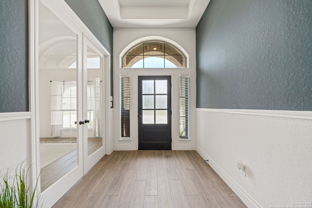 9102 War Wagon, San Antonio, TX 78254 - entryway featuring a textured wall, wood finished floors, plenty of natural light, and french doors