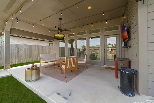 9102 War Wagon, San Antonio, TX 78254 - view of patio / terrace with a ceiling fan and an outdoor living space with a fire pit