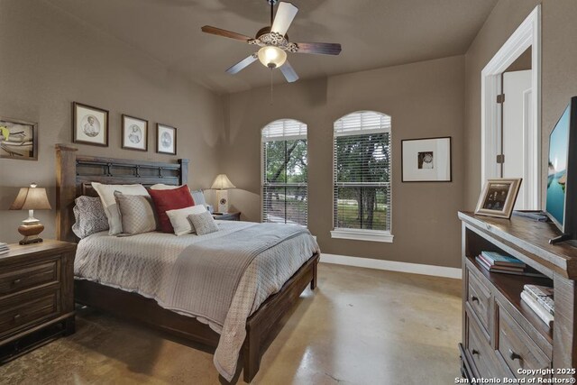 835 Shady Holw, New Braunfels, TX 78132 - bedroom featuring baseboards, concrete flooring, and ceiling fan