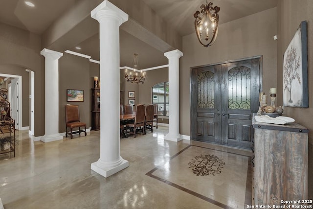 835 Shady Holw, New Braunfels, TX 78132 - foyer with a chandelier, ornate columns, baseboards, concrete floors, and crown molding