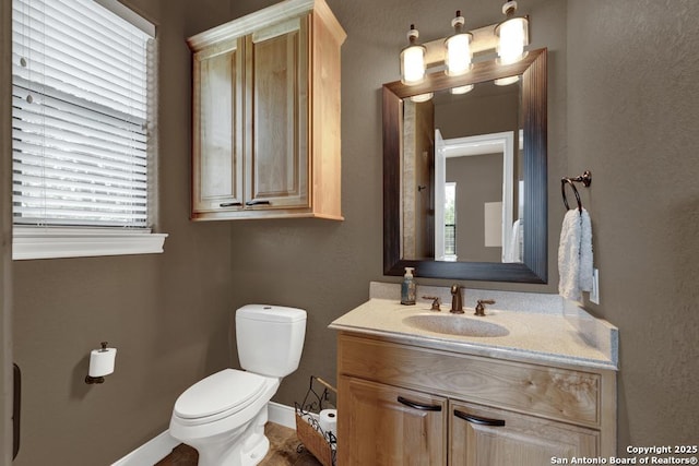 835 Shady Holw, New Braunfels, TX 78132 - bathroom featuring toilet, baseboards, and vanity