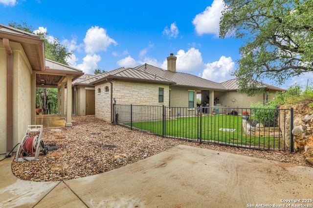 835 Shady Holw, New Braunfels, TX 78132 - view of property exterior with a standing seam roof, a chimney, metal roof, a patio area, and stone siding