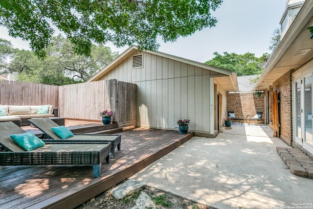 13603 Cobble Way, San Antonio, TX 78231 - wooden deck with an outdoor hangout area, a fenced backyard, and a patio