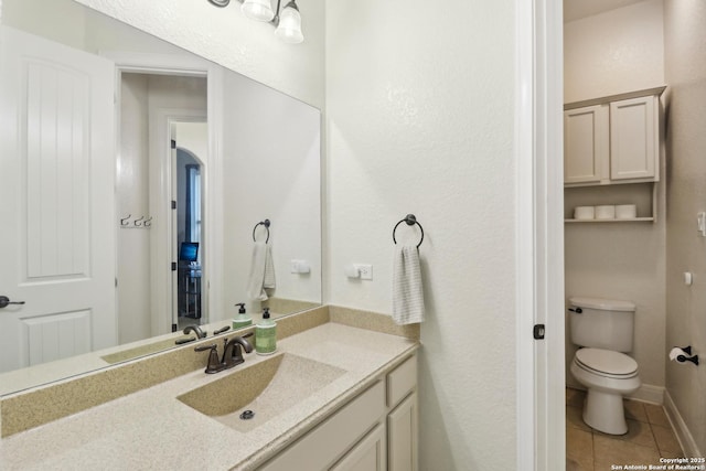28534 Tristant Rdg, San Antonio, TX 78260 - bathroom featuring tile patterned floors, toilet, and vanity