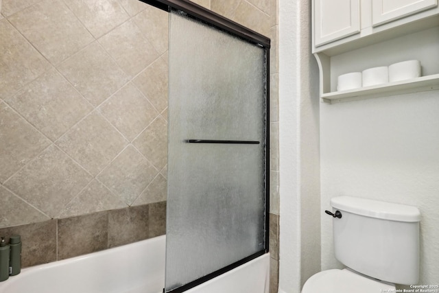 28534 Tristant Rdg, San Antonio, TX 78260 - full bathroom featuring shower / bath combination with glass door and toilet