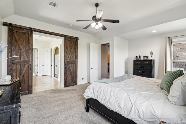 28534 Tristant Rdg, San Antonio, TX 78260 - carpeted bedroom featuring a barn door, baseboards, ceiling fan, tile patterned floors, and recessed lighting