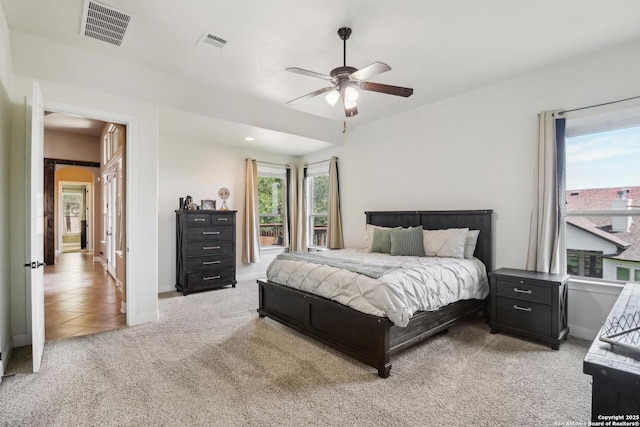28534 Tristant Rdg, San Antonio, TX 78260 - bedroom featuring light carpet, arched walkways, baseboards, and ceiling fan