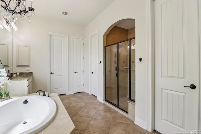 28534 Tristant Rdg, San Antonio, TX 78260 - bathroom featuring a stall shower, a bath, tile patterned floors, vanity, and baseboards