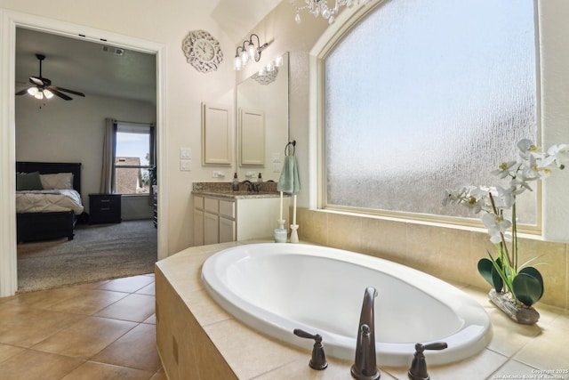 28534 Tristant Rdg, San Antonio, TX 78260 - bathroom featuring ensuite bathroom, a ceiling fan, vanity, a bath, and tile patterned flooring
