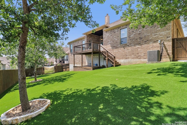 28534 Tristant Rdg, San Antonio, TX 78260 - back of property featuring a chimney, stairs, a wooden deck, brick siding, and central AC